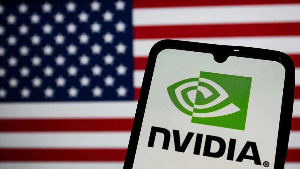 The mobile phone showing Nvidia's logo on the screen in front of another screen showing the US flag