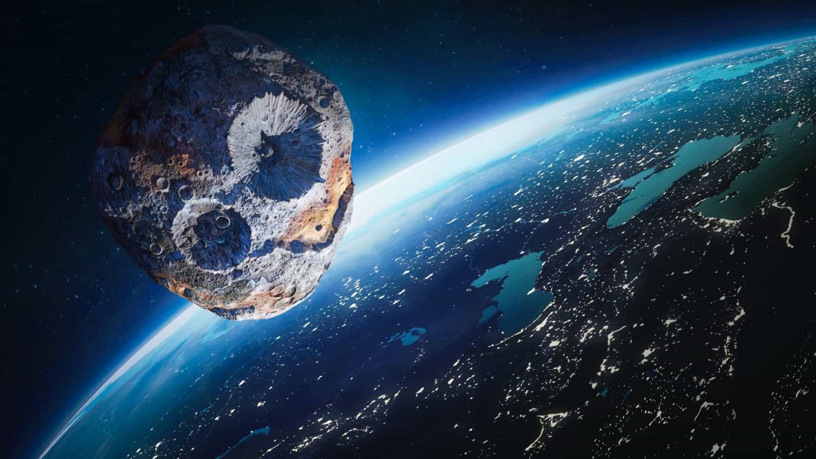 The image shows the asteroid in space near planet Earth.